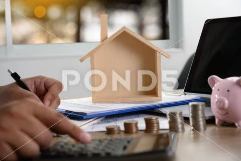 The concept of home ownership Business people negotiating a contract This is Stock Photos