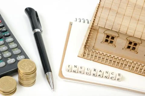 Concept of housing purchase and insurance. Office desk table with supplies top Stock Photos