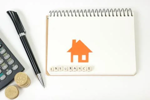 Concept of housing purchase and insurance. Office desk table with supplies top Fotos de archivo