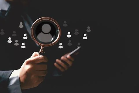Concept of human resource recruitment visuals of magnifying glass highlight.. Stock Photos