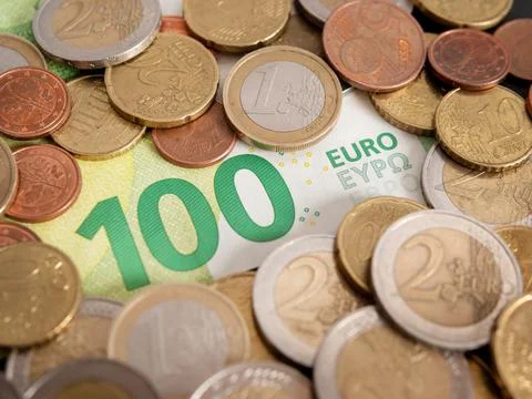 Concept Idea: Abstract background with 100 euro note and euro coins Stock Photos