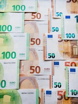 Concept Idea: Abstract background with 50 and 100 euro note bills Stock Photos
