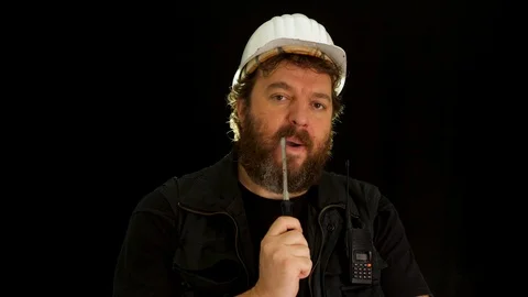 Concept idea: Bearded construction worker with a large screwdriver is slowly  스톡 동영상 121601324