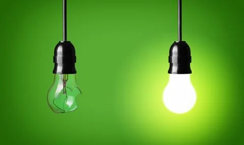 Concept idea with broken and glowing bulb Stock Photos