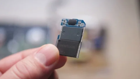 Concept Idea: Bulk SD Card Board In The Male Hand Stockbeeldmateriaal 101307838