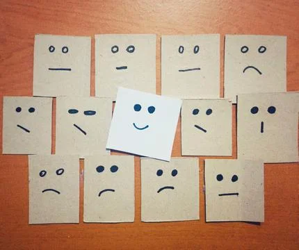 The concept of the idea facial expression of several sheets of paper. Fotos Stock