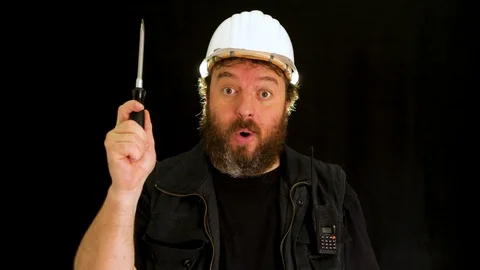 Concept idea: Funny bearded construction worker with helmet thinks and comes  Vídeo Stock 121602825