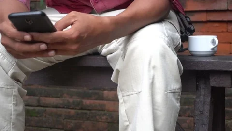 Concept idea man hold smart phone and text messaging Video stock 227502092