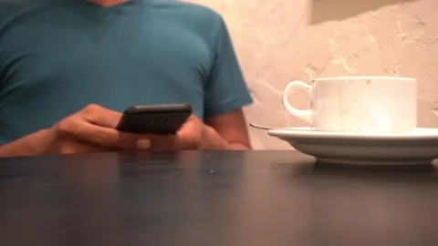 Concept idea man hold smart phone and text messaging Video stock 227504444