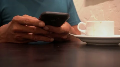 Concept idea man hold smart phone and text messaging Video stock 227512599