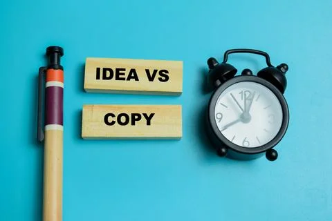 Concept of idea vs copy text on wooden blocks. Stock Photos
