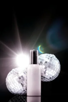 Concept image of cosmetic container using mirror ball. Stock Photos