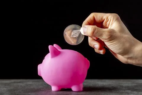 Concept image for using digital crypto currency for savings. A caucasian woma Stock Photos