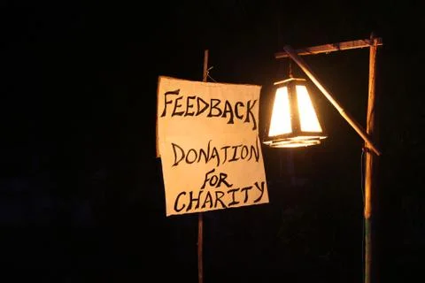 Concept image, word FEEDBACK on white canvas and pole with night lamp Stock Photos