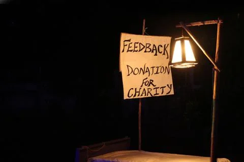 Concept image, word FEEDBACK on white canvas and pole with night lamp Stock Photos