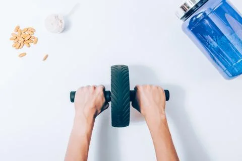 Concept of improving body shape using sports equipment 库存照片