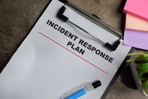 Concept of incident response plan write on clipboard isolated on Wooden Table Stock Photos