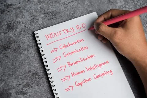 Concept of Industry 5.0 write on book isolated on Wooden Table. Stockfoto's