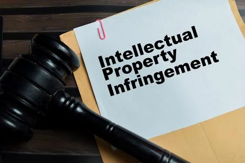 Concept of intellectual property infringement write on legal document Stock Photos