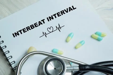 Concept of interbeat interval write on book isolated on Wooden Table. Stock Photos