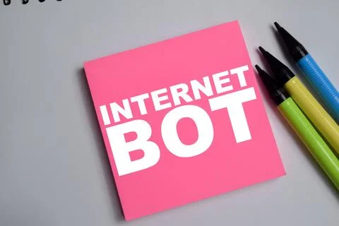 Concept of internet bot write on sticky notes isolated on Wooden Table. Stockfoto's