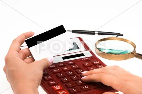 Concept for Internet shopping: hands with calculator and credit card Stock Photos
