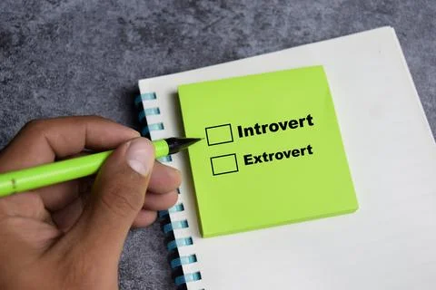 Concept of Introvert or extrovert write on sticky notes Stock Photos