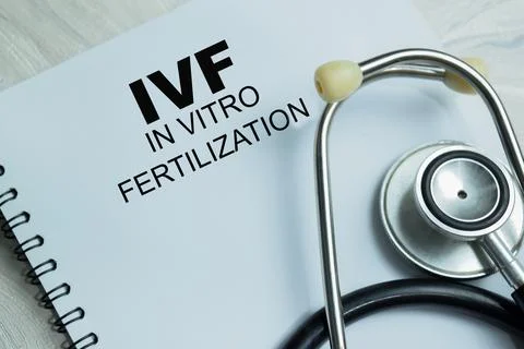 Concept of IVF - In Vitro Fertilization write on book Stock Photos