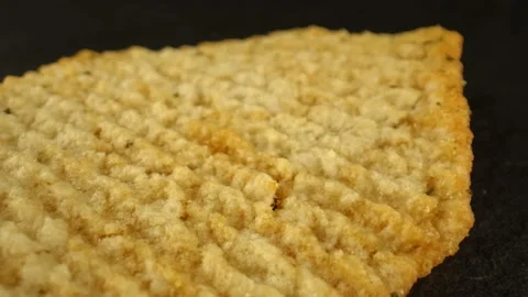 The concept of junk food. Thin crispy chips on the black background. High Stock Footage 165191345