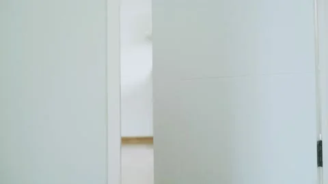 Concept for kid. A brown teddy bear poked his face from behind the wall. The  Video stock 164159214