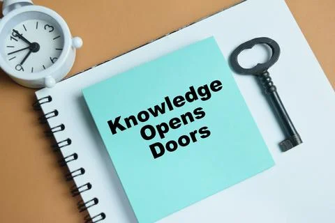 Concept of knowledge opens doors write on sticky notes isolated on table Photos