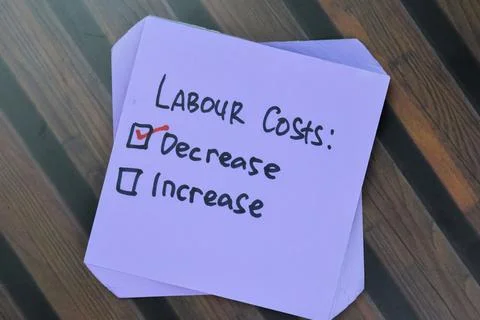 Concept of Labour Costs. Decrease or Increase write on sticky notes 스톡 사진