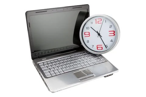 Concept laptop computer and desktop clock. Time is money. Stock Photos