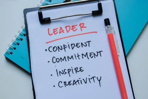 Concept of Leader write on paperwork with keyword isolated on Wooden Table. Stockfoto's