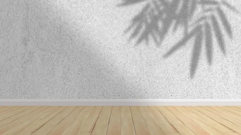 Concept of leaf shadow and light on gray cement wall and wooden floor. Stock Photos