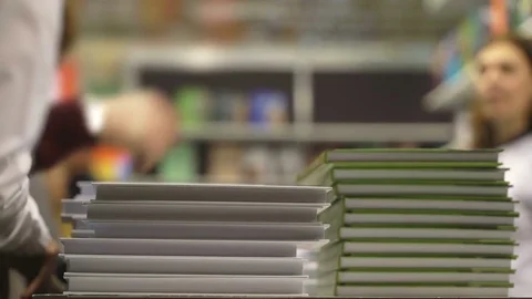 Concept learning and knowledge. Bookstore shelves with book stacks in bookstore Stock Footage 84330990