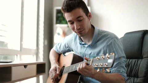 Concept of Learning, practicing Guitar as hobby and Relaxing Stock Footage 202277527