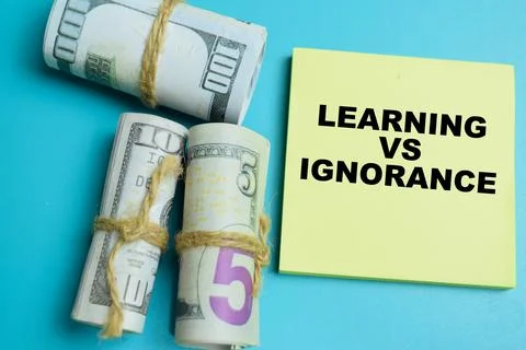 Concept of learning vs ignorance write on sticky notes isolated on table. Stock Photos