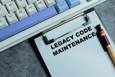 Concept of legal code maintenance write on clipboard isolated on Wooden Table Stockfoto's