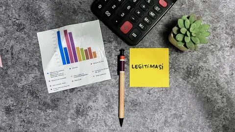 Concept of Legitimasi write on sticky notes isolated on Wooden Table. Stock Photos