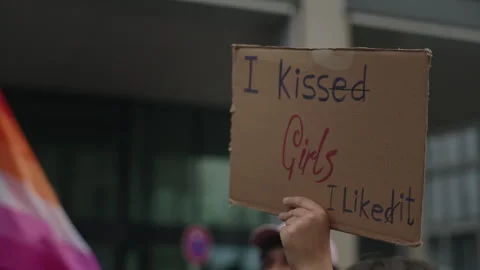 Concept of LGBTQ pride, self-acceptance and love. Hand holds up a handmade Stock Footage 346239753