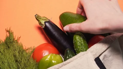 The concept of life without waste. Hands take out beautiful fresh vegetables Stock Footage 125896119