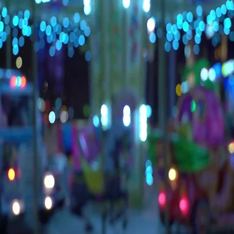 Concept - lifetime. Carousel on Blur Background of Night City Traffic. Looped Stock Footage 69520017