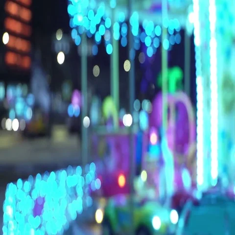 Concept - lifetime. Empty Carousel on Blur Background of Night City Traffic Stock Footage 69513937