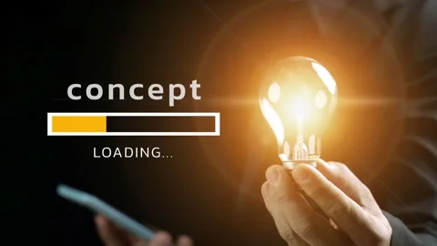 Concept is loading with a businessman is holding lighted lightbulb on his hand Video stock 266957820