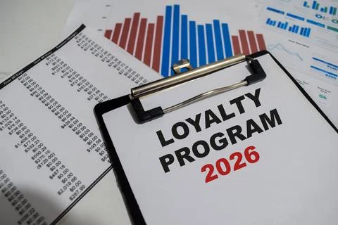 Concept of Loyalty Program 2026 write on paperwork isolated on Wooden Table. Stock Photos