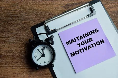 Concept of maintaining your motivation write on sticky notes Stock Photos