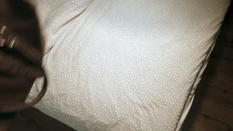 Concept, man packs a overnight bag in a hurry, and pauses to admire a Stock Footage 101971645