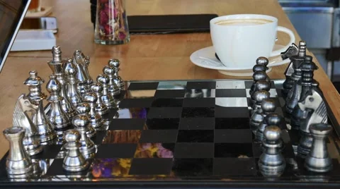 Concept of Man playing silver chess Stock Footage 64097914