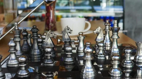 Concept of Man playing silver chess Stock Footage 64099587